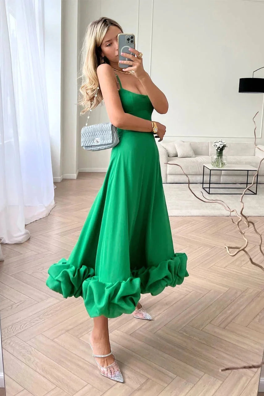 Green sleeveless maxi dress with ruffled tiers, perfect for a summer day out. Made of lightweight and breathable fabric for…