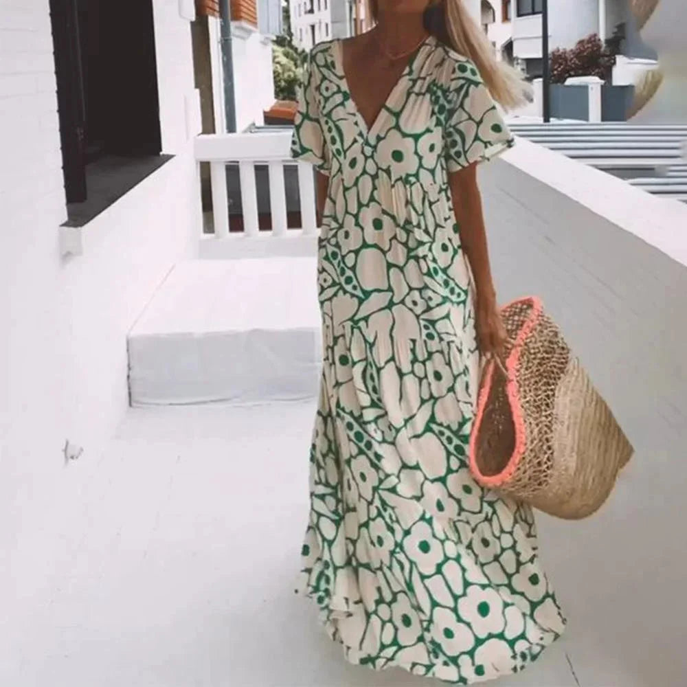 "Julianna maxi dress in floral print with cap sleeves. Soft and flowy fabric, perfect for sunny days and casual gatherings."