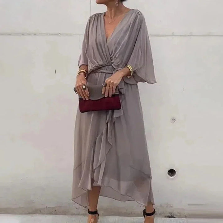 Gray V-neck midi wrap dress with tie waist. Features a flattering silhouette, made of soft, comfortable fabric for all-day…