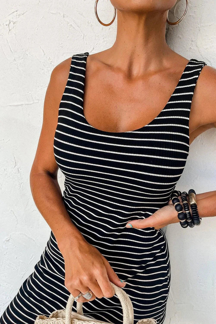 Navy and white striped sleeveless mini dress featuring a classic design with a sleek silhouette perfect for casual or formal…