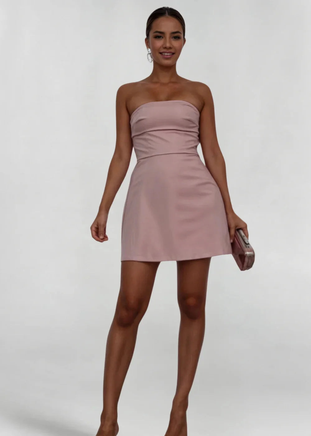 "Blush strapless mini dress with matching clutch set, featuring a delicate design suitable for formal occasions."