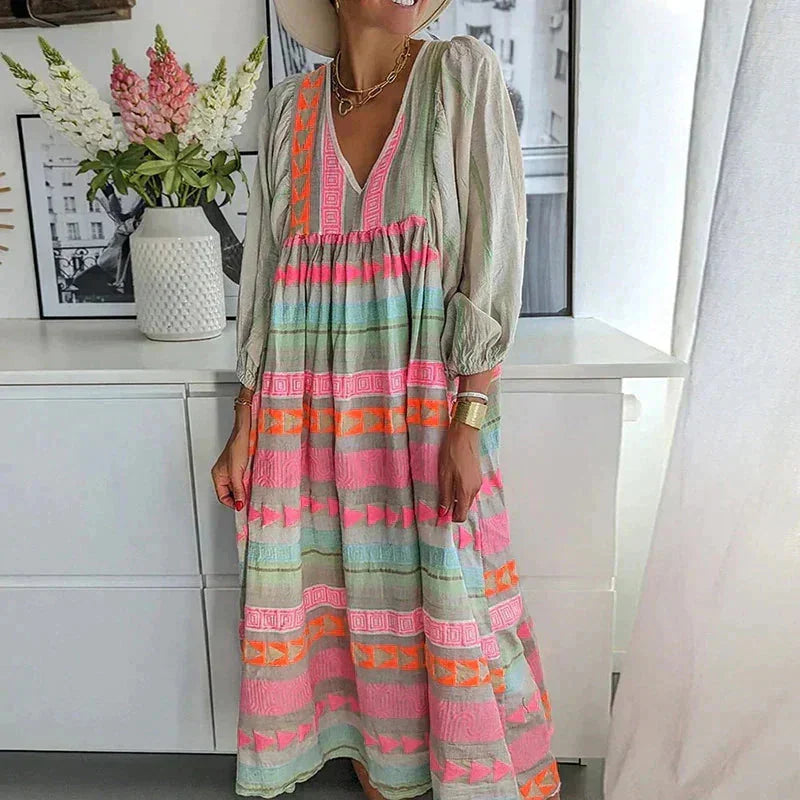 "Cotton striped maxi dress in soft pastel tones, perfect for a casual and breezy look."