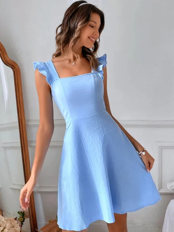 Sky blue flared mini dress with ruffle detail, made of soft and breathable fabric. Perfect for a sunny day out or casual…