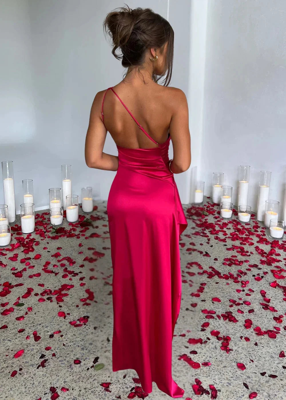 One-shoulder satin dress with slit in elegant design, perfect for a special occasion or evening event.