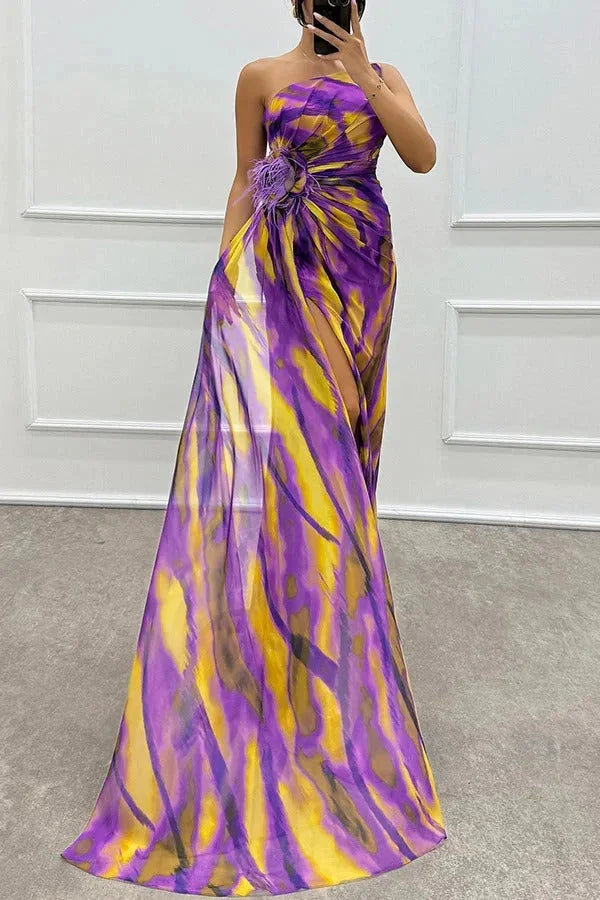 "Karla maxi dress featuring bold floral pattern, side slit, and v-neck. Made with soft and flowy fabric for a stylish summer…