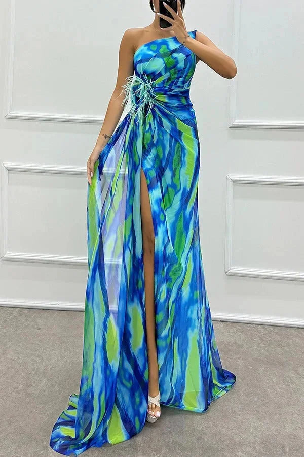 Blue floral maxi dress with side slit, perfect for any occasion. Made from soft flowy fabric ensuring comfort and style.