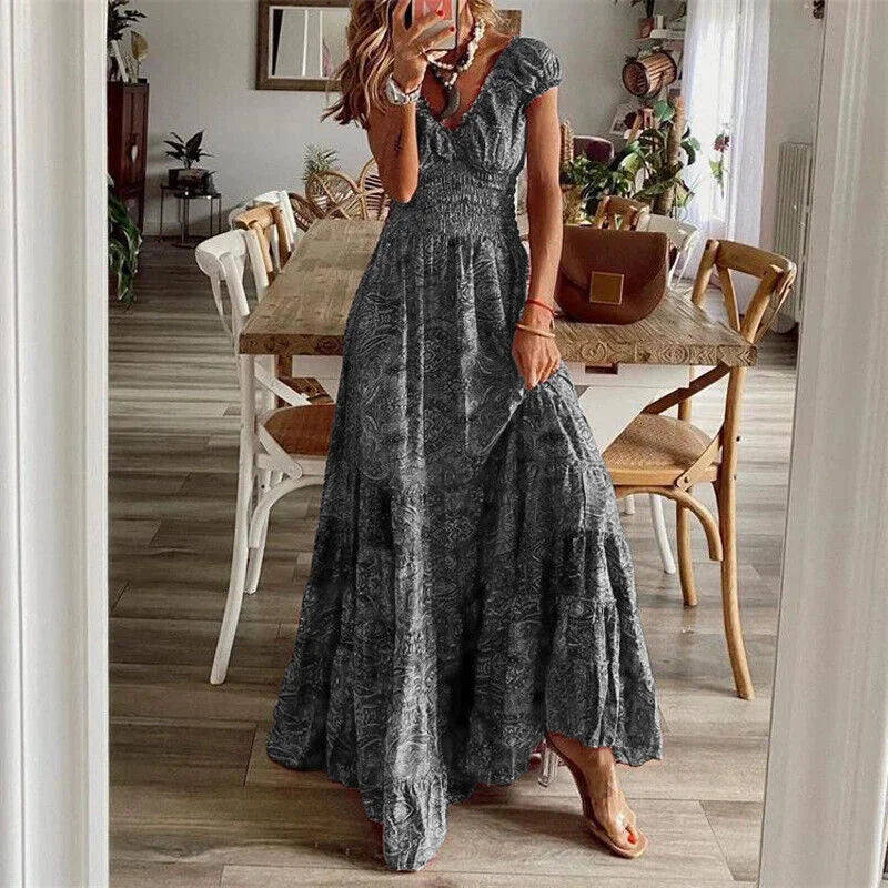 "Gray tiered boho dress with sleeves, perfect for a casual yet chic look, made from lightweight and breathable fabric."