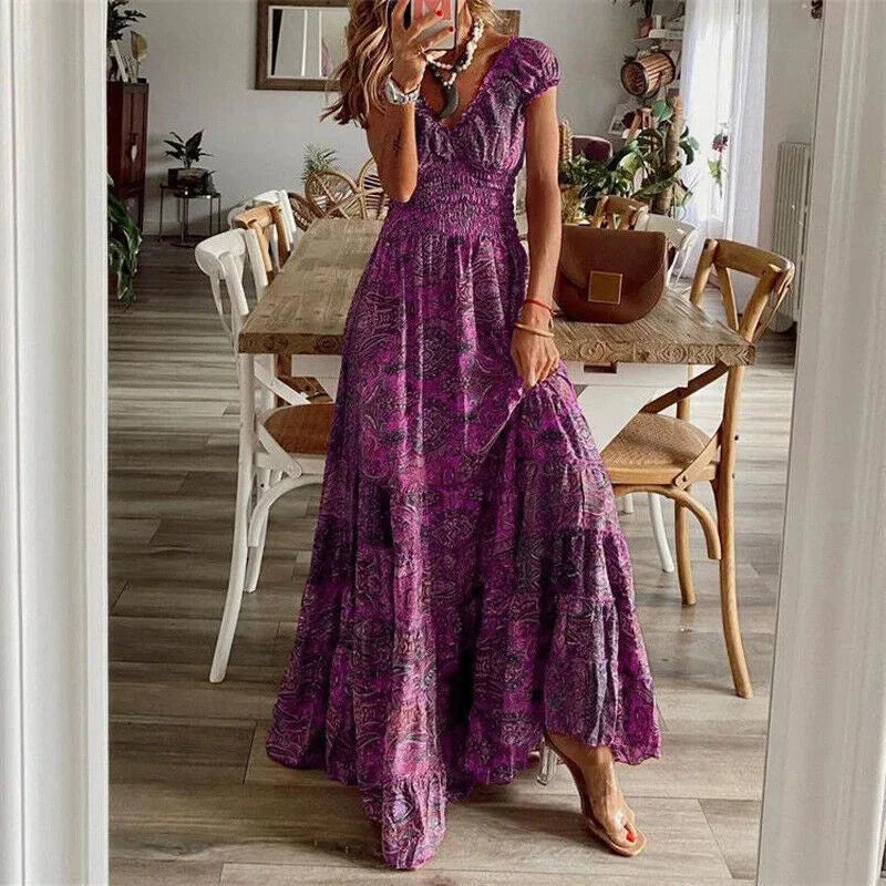 Purple tiered boho dress with sleeves, flowing and comfortable for casual wear, in a relaxed fit perfect for a bohemian…