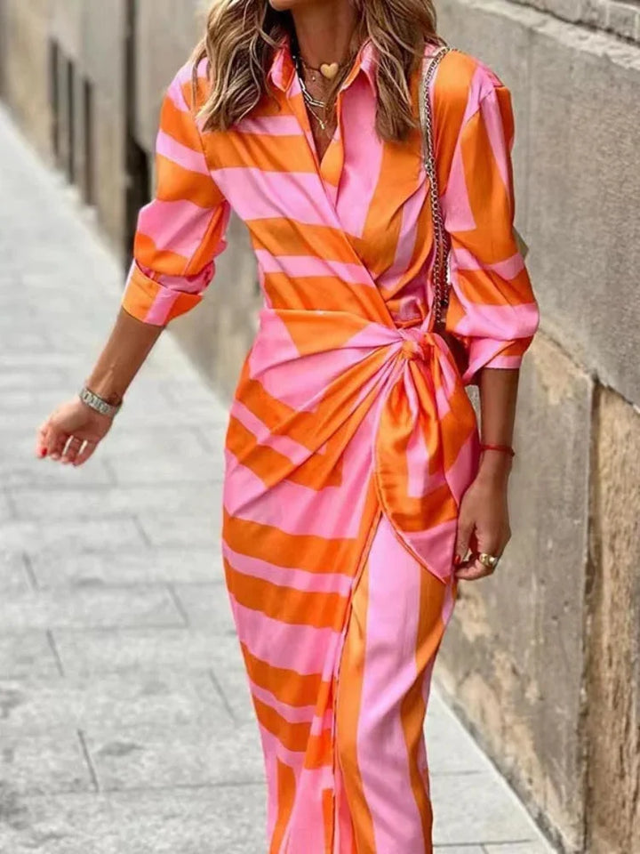 Orange pink belted wrap dress with shirt collar. Soft and flowy fabric with a flattering silhouette perfect for any occasion.