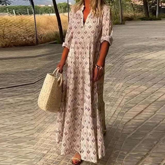 "Keely maxi dress in a flowy design with a v-neck, perfect for effortless and comfortable styling."