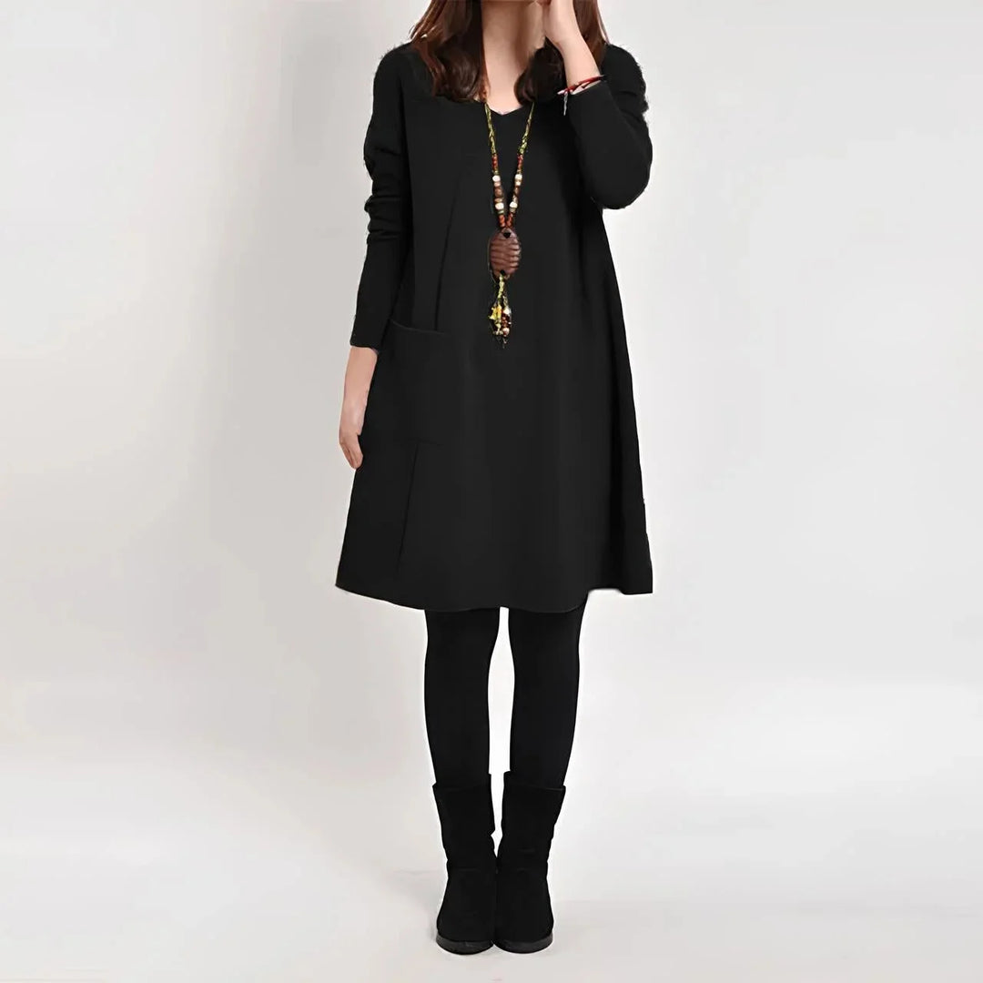 Black long sleeve shift dress with pockets, made from soft and stretchy fabric for all-day comfort. Chic and functional…