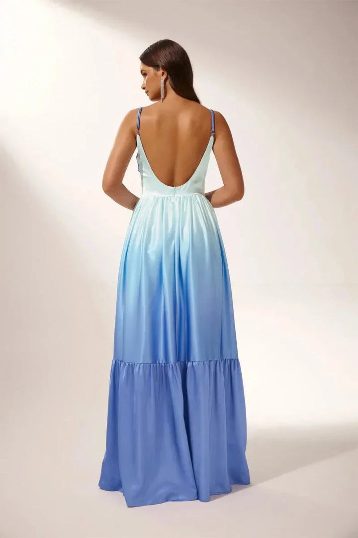 Ombre blue maxi dress featuring chic cut-outs, perfect for any occasion with a flattering silhouette and comfortable fabric…