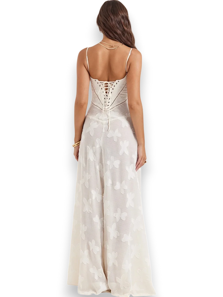 "Embroidered maxi dress in light, breathable fabric with spaghetti straps, perfect for summer evenings."