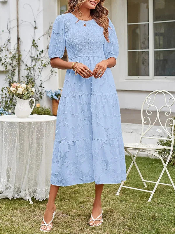 Blue floral textured tiered midi dress with a soft and flowy fabric perfect for a casual chic look.