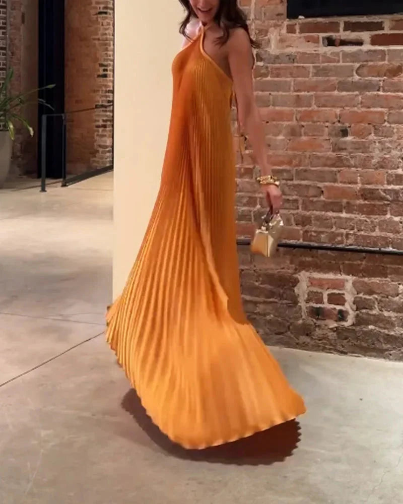 Orange halter neck maxi dress, featuring a flowy silhouette and lightweight fabric perfect for summer outings.