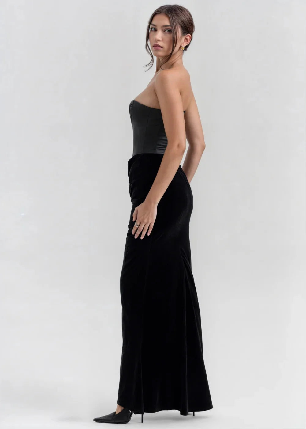 "Black velvet strapless evening dress with elegant design"