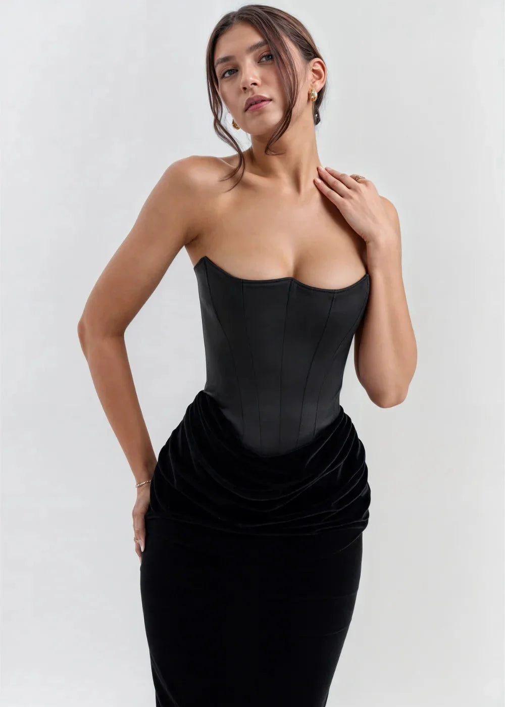 Strapless black velvet evening dress with a fitted silhouette and elegant design for a stylish look.