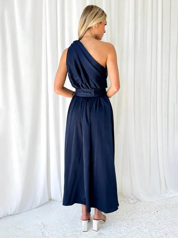 "Black one-shoulder maxi dress with belt, softly flowing design, perfect for everyday wear or special occasions from Legaci."