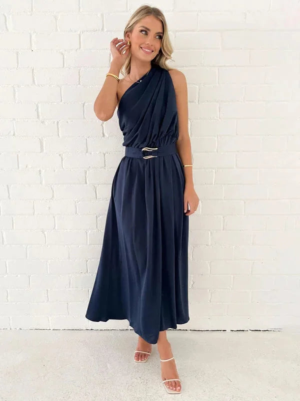 "Navy one-shoulder dress with belt, flowy silhouette, soft fabric, perfect for day or night outings."