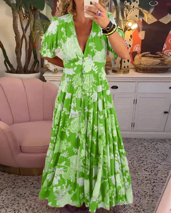 Green floral V-neck midi dress with a flowy skirt, perfect for summertime outings. Featuring a lightweight and breathable…