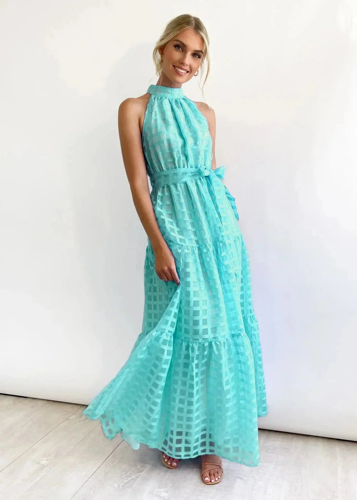 Cyan sleeveless maxi dress with high neckline, featuring a flowy design suitable for a casual or formal look.