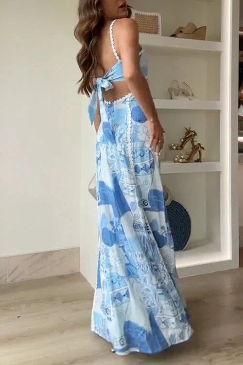 Blue patterned maxi dress with a stylish bow detail, made from soft and comfortable fabric, perfect for a chic and trendy…