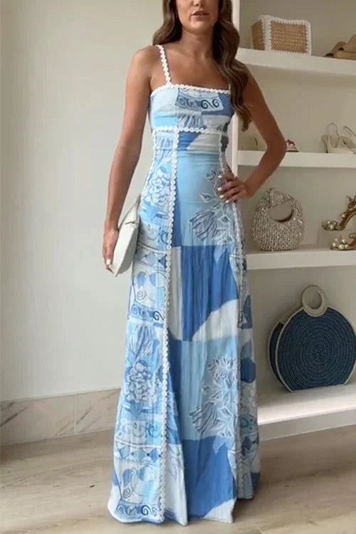 Blue patterned maxi dress with bow detail made from soft chiffon fabric. Features a unique design perfect for casual or…