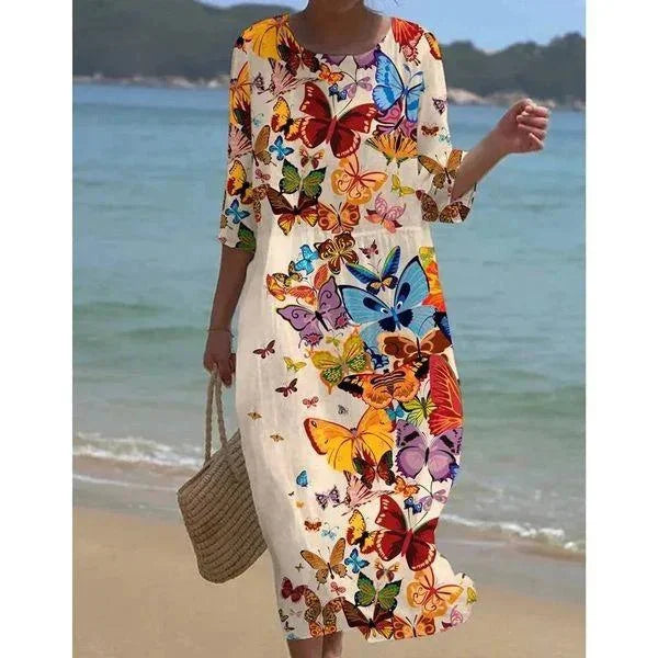 Louisa - Sleeved midi floral beach dress in Butterflies design with lightweight, breezy fabric and vibrant floral print.