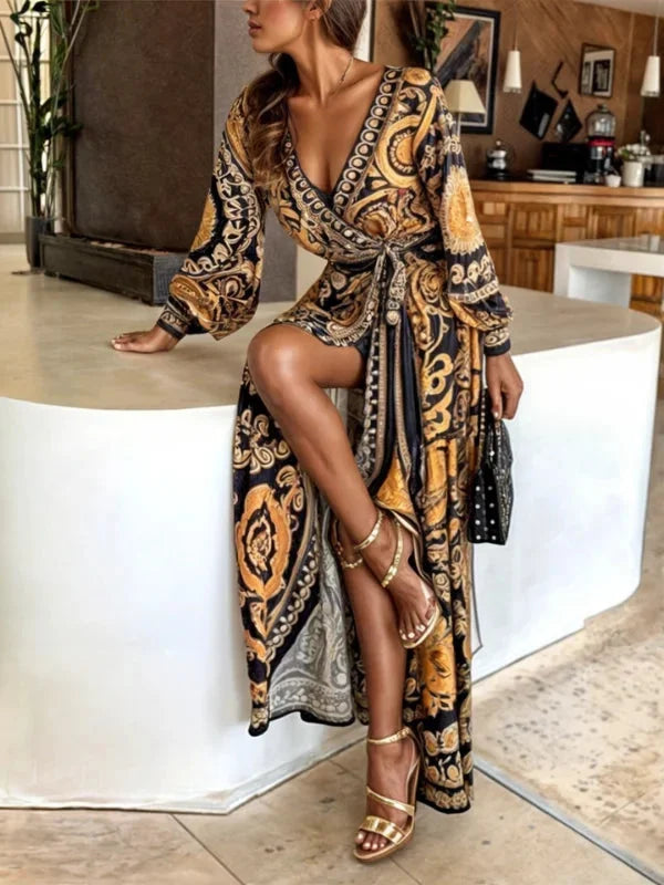 "Bohemian maxi dress with v-neck and golden print, flowing and lightweight fabric ideal for casual events or gatherings."