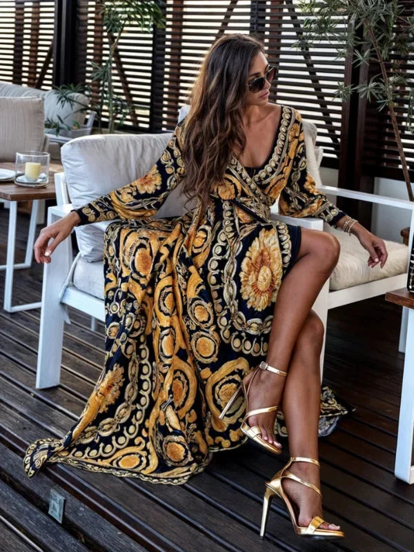 Bohemian maxi dress featuring a V-neckline and golden print design, perfect for casual chic style.