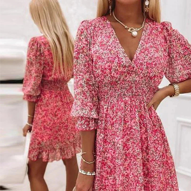 A graceful V-neckline Boho dress featuring a lovely floral pattern on a soft, flowing fabric, perfect for a relaxed and…