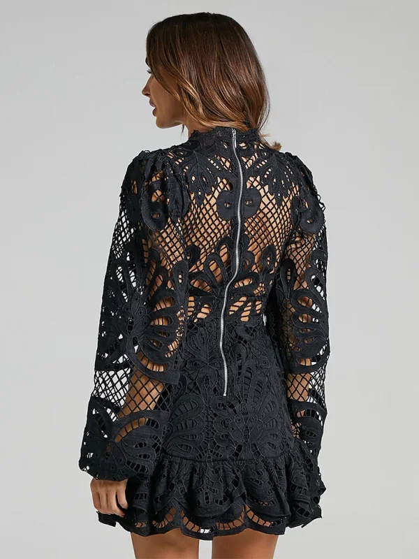 "Black long sleeve ruffled lace mini dress with intricate design detail and elegant silhouette."