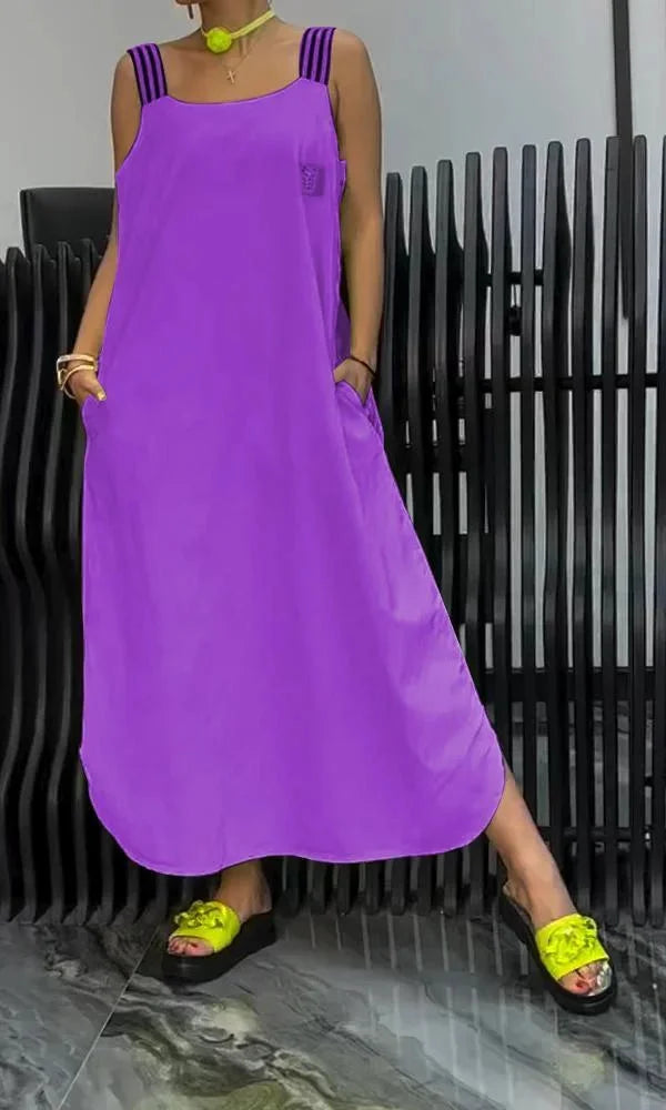 Maeven sleeveless relaxed maxi dress in navy blue with side pockets, made of lightweight breathable cotton blend fabric.