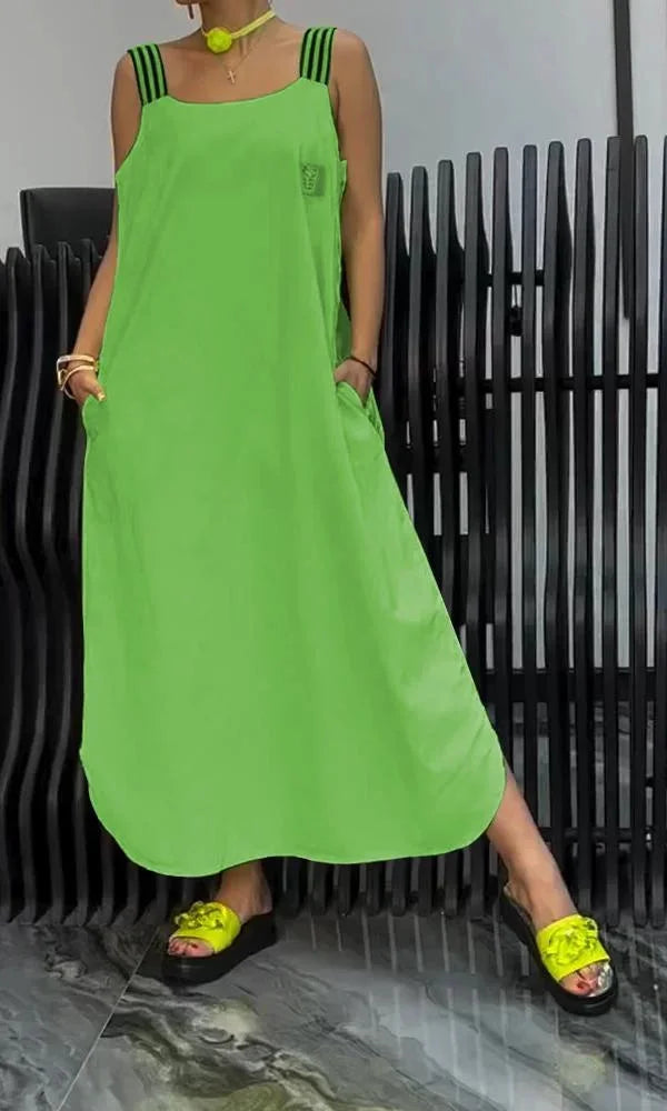 "Sleeveless maxi dress in soft cotton blend with convenient pockets, perfect for casual wear or outdoor events."