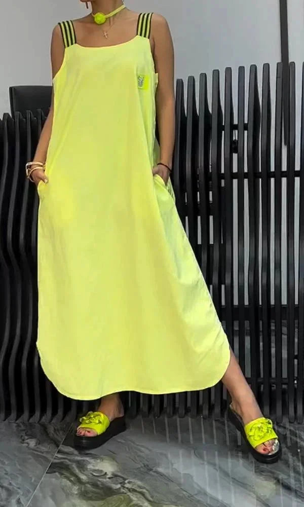 "Sleeveless maxi dress in Yellow, featuring relaxed fit, convenient pockets, and comfortable fabric for a stylish everyday…