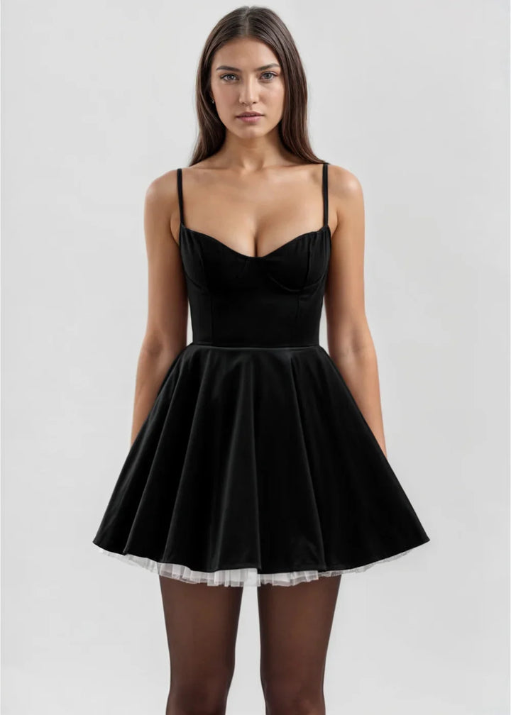 Black velvet mini dress with sheer accent, a chic addition to your wardrobe for a touch of elegance and sophistication.