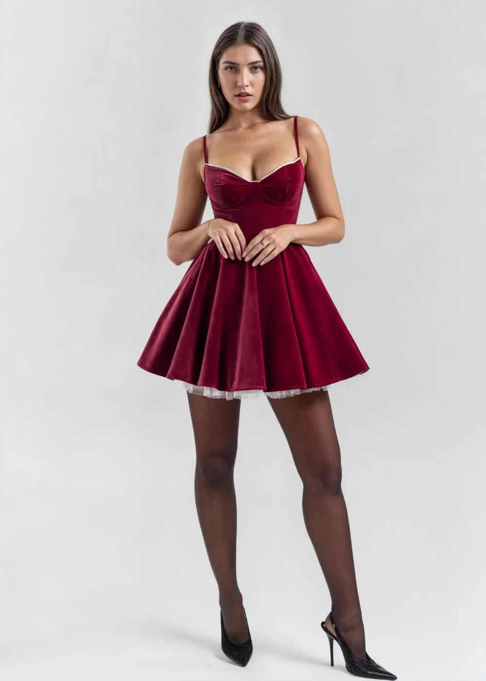 Red wine velvet mini dress with sheer accent showing elegant design and rich texture.