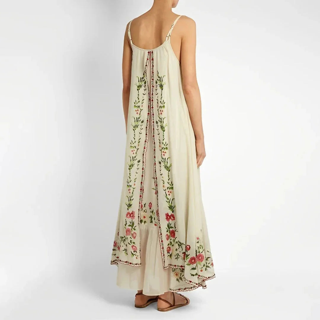 "Malak spaghetti strap maxi dress with floral print, made from lightweight fabric. Perfect for a stylish and effortless…