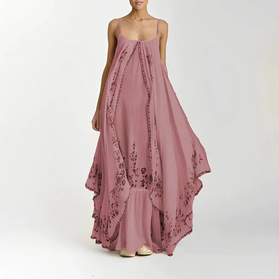 Pink floral maxi dress with spaghetti straps, made from lightweight breathable fabric. Flowy and perfect for summer days.