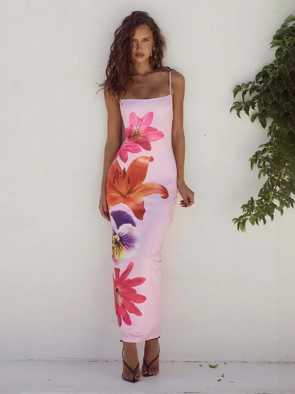 Pink Malka maxi dress in slim-fit silhouette with floral print. Made with lightweight fabric ideal for spring and summer…