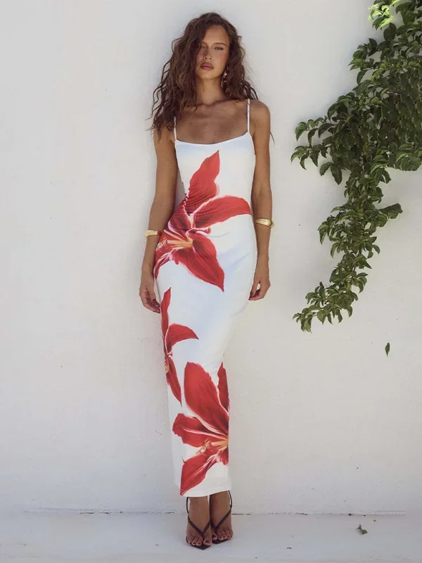 White floral slip maxi dress with slim-fit design, perfect for a breezy summer day. Made with lightweight and flowy fabric.