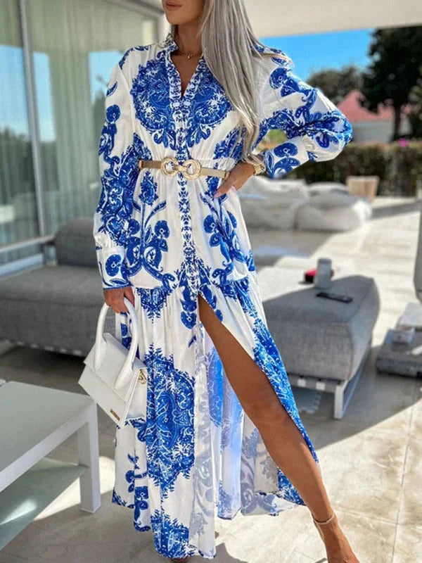 Blue paisley print maxi dress with elegant high slit, made from soft and flowy fabric. Perfect for a stylish and breezy look.