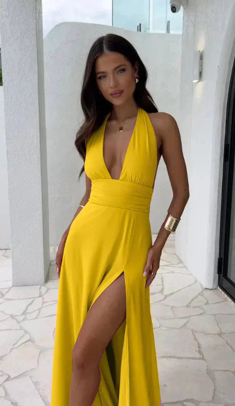 Yellow Melisa dress with plunging neckline and leg slit, made of soft flowing fabric, perfect for a sophisticated and…