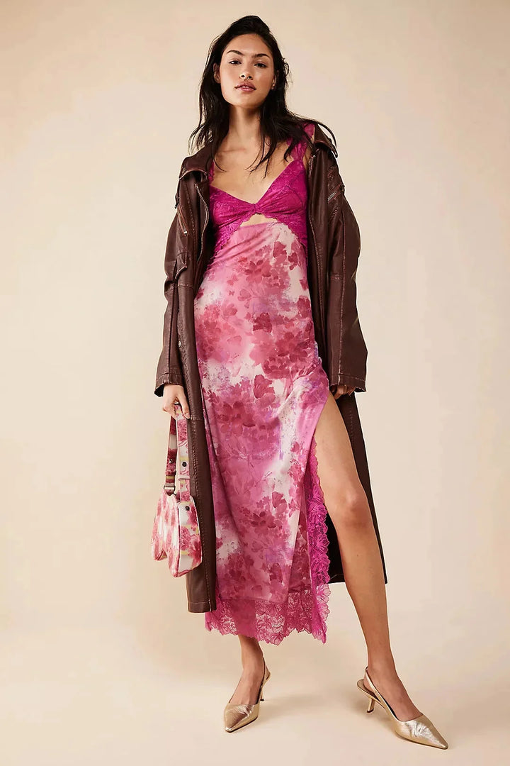 Sheer maxi dress with vibrant floral print, perfect for spring & summer, featuring a flowy silhouette & delicate fabric.