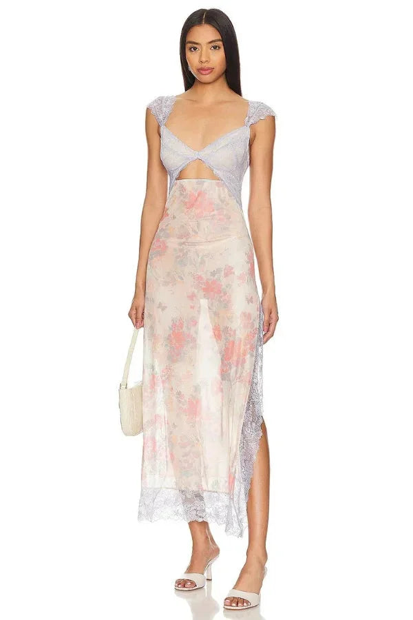 Sheer maxi dress with floral print in soft chiffon fabric, perfect for a bohemian-chic look.