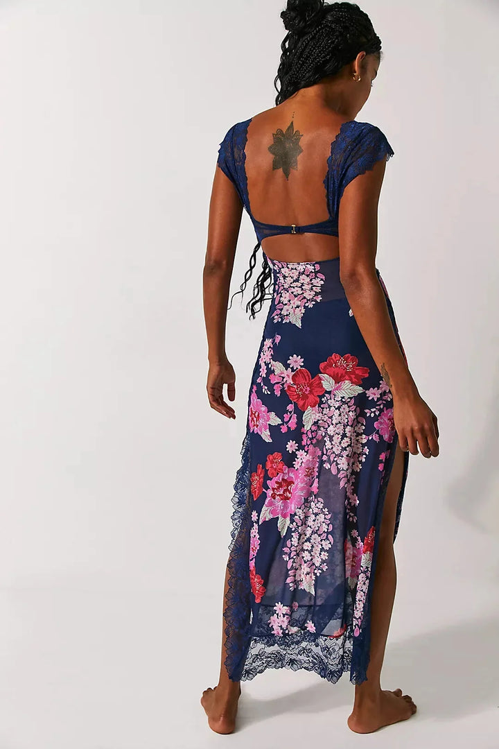 Sheer maxi dress with floral print in pastel colors, perfect for summer occasions.