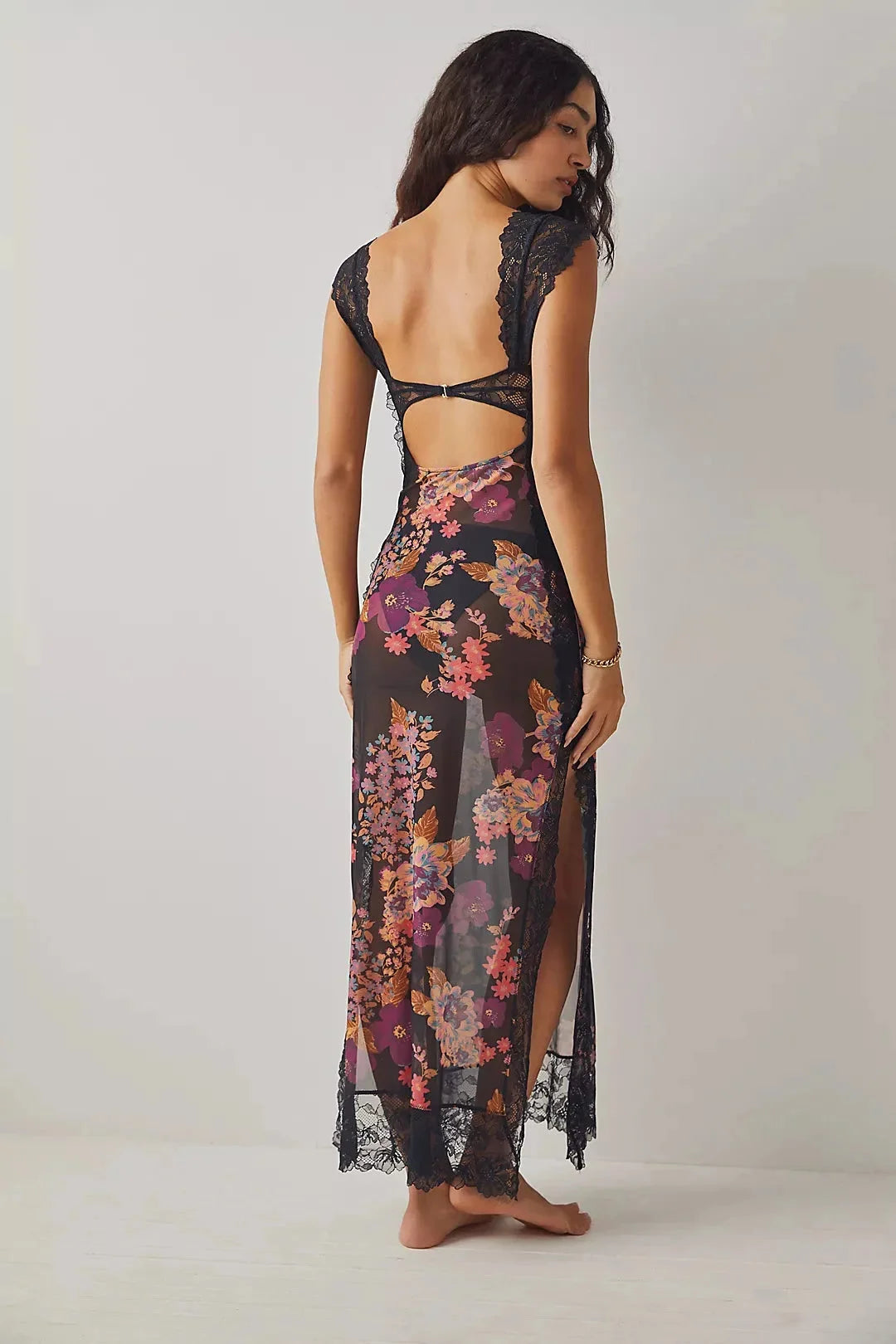 "Sheer maxi dress with floral print in soft, flowy fabric, perfect for summer outings and beach days"