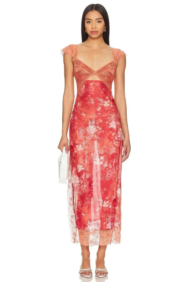 Sheer apricot maxi dress with floral print, perfect for a breezy summer day.