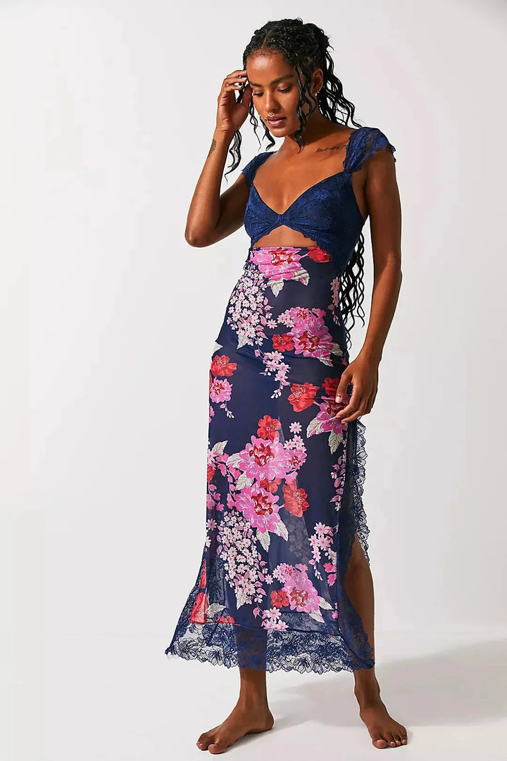 Sheer maxi dress with midnight blue floral print, perfect for summer evenings, made of lightweight and flowy fabric.