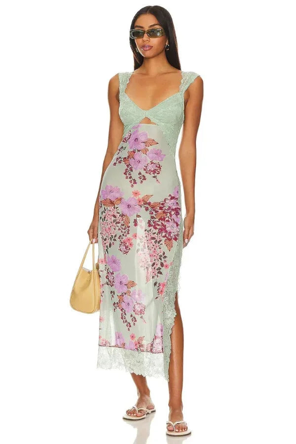 Sheer sage maxi dress with floral print, perfect for sunny days.